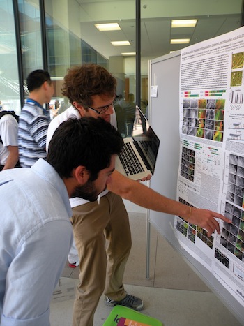 Discussion in front of a poster at the AMC 2013 in San Diego